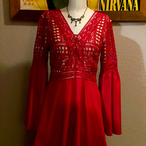 Brand new red dress, embroidered top and flows out just above the knees. - Picture 2 of 5